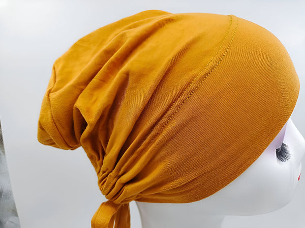 Chapeau musulman en coton de couleur moutarde, idéal pour un look chic et élégant.