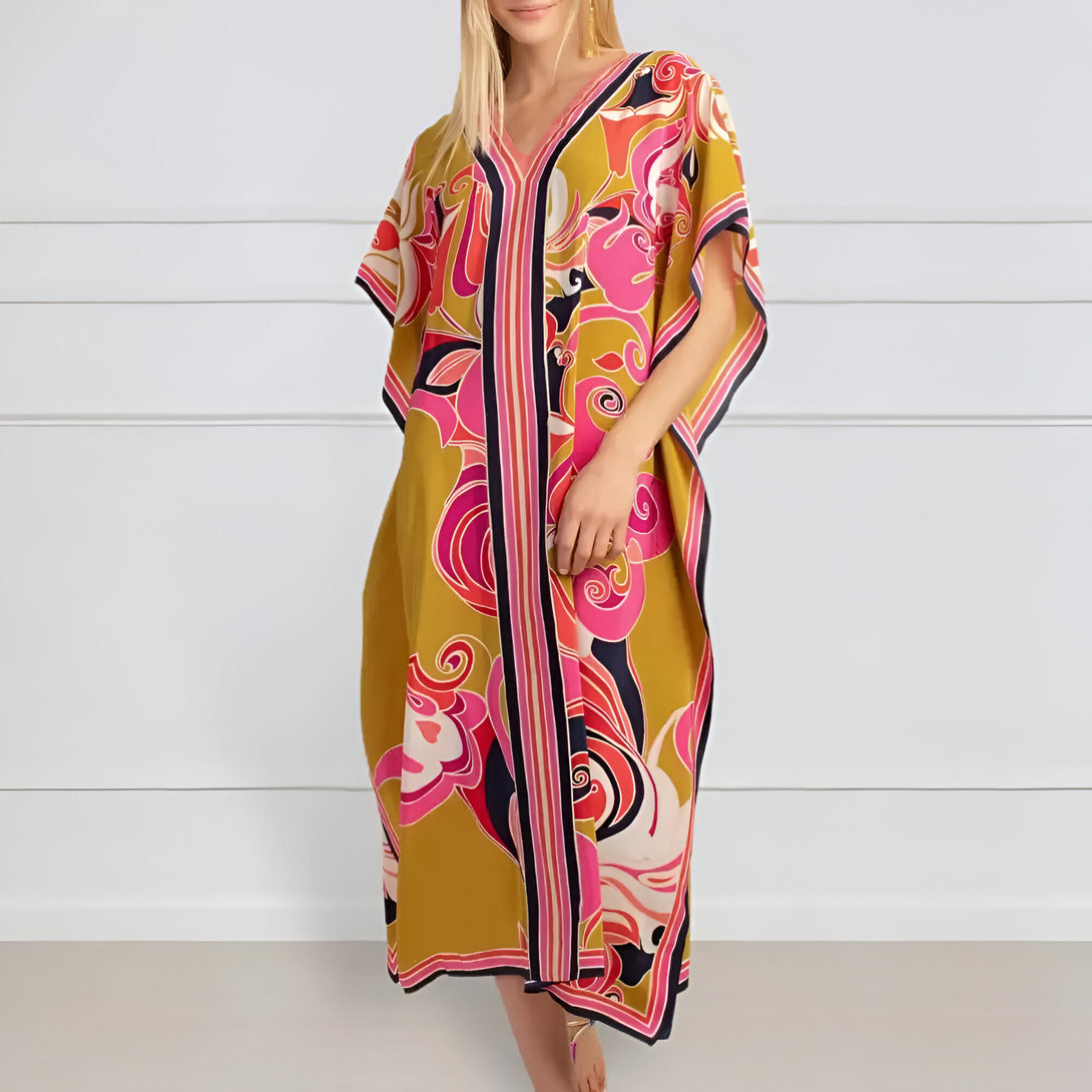 Une robe longue à manches courtes avec un imprimé floral coloré, idéale pour les femmes musulmanes.  La robe est de couleur jaune moutarde et a un décolleté en V.  Elle est parfaite pour les occasions spéciales ou pour un look décontracté.