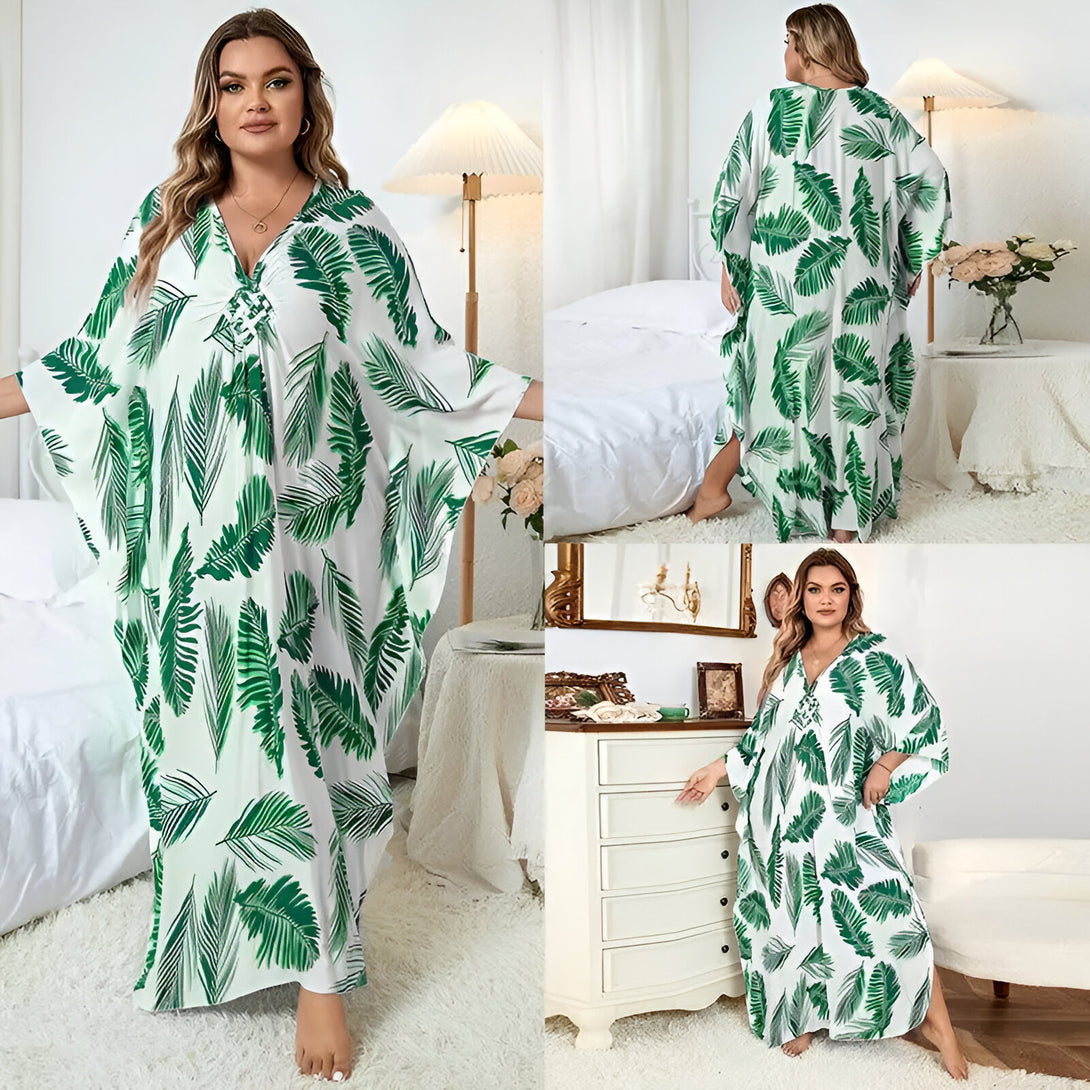 Robe longue musulmane blanche avec un motif de feuilles vertes. La robe est ample et fluide, parfaite pour les journées chaudes. Elle est disponible en plusieurs tailles.